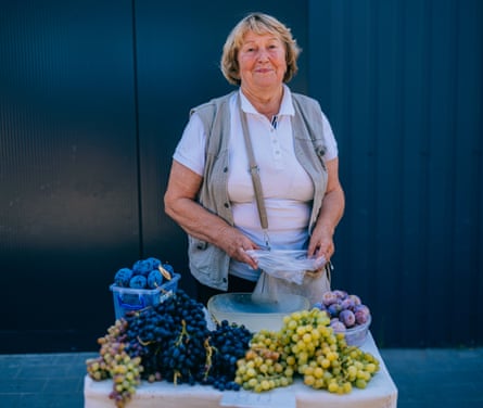 Valentyna selling grapes at the market 
