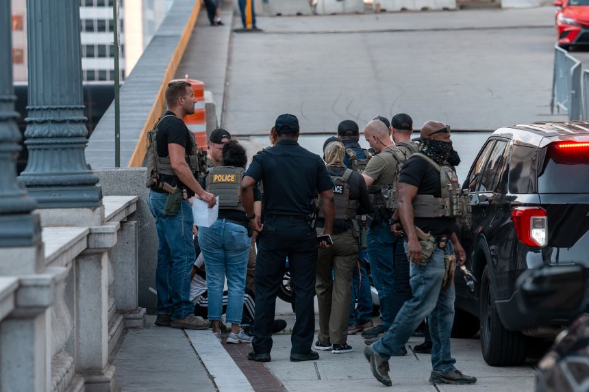 ICE and other federal agents take a delivery driver into custody on August 16 at Union Station in Washington, DC.