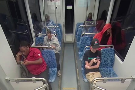 screenshot of people sitting on train