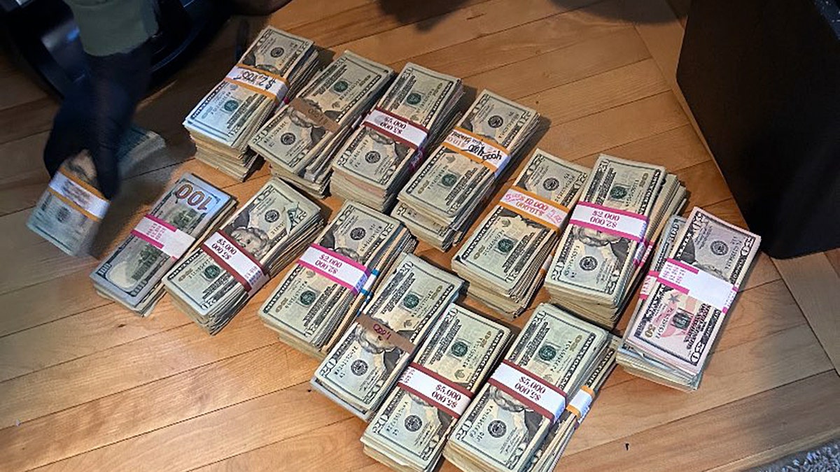 Bundles of seized cash from New Hampshire fentanyl and meth bust tied to Sinaloa Cartel.