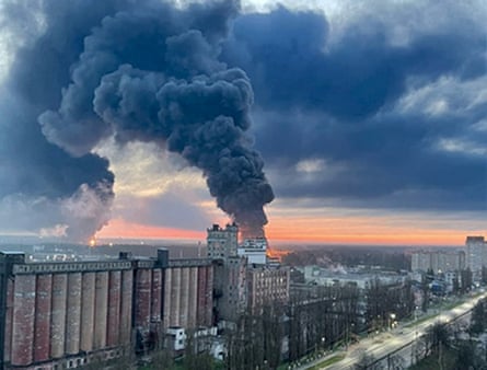 Black smoke rises from an oil storage facility 