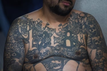 The tattooed chest of Ever Sinay, a leader of the 18th Street gang
