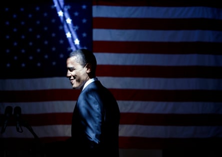 A shaft of light falls on Democratic presidential candidate Barack Obama, smiling in front of the American flag, following a rally at the American GI Forum in San Antonio, Texas,  March 3 2008