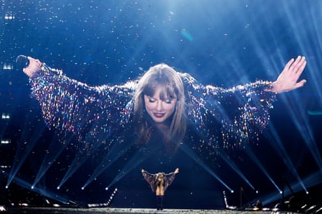 Taylor Swift performs onstage, with her image projected behind her, during her Eras tour, on November 14 2024, in Toronto, Ontario