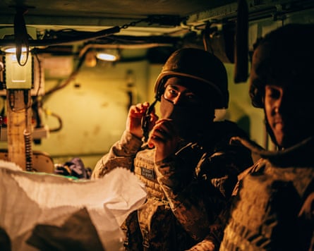 Soldiers sitting in the back of the vehicle