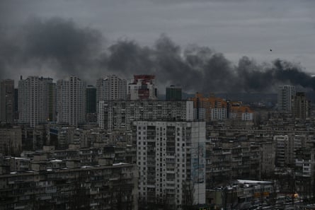 Smoke rises above residential buildings