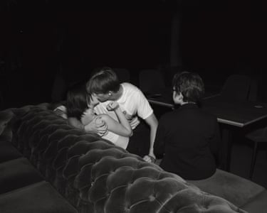 The First Kiss, 2024 ‘The kids invited us to an under-18s nightclub, 30km from the frontline. Daily drone and missile attacks, and then this: the awkwardness, the tangible excitement of a first kiss, the friend sitting to one side not knowing what to do, the grip of the boy’s hand on the girl’s shoulder, her hand hovering below his chin. There’s something so beautifully human and innocent about it. It’s relatable in a way that war almost never is.”