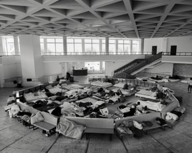 Shot in stark black and white, Wet Ground moves beyond the visual shorthand of war imagery, presenting scenes that are domestic, absurd, performative or oblique.