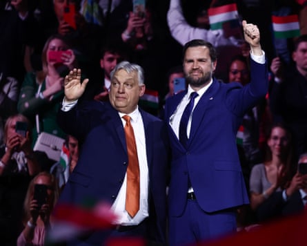 Vicktor Orbán and JD Vance on a stage at a rally in Budapest.