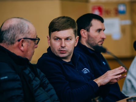 Serhii Tarakanov, Chornobyl’s director general, talks to a colleague