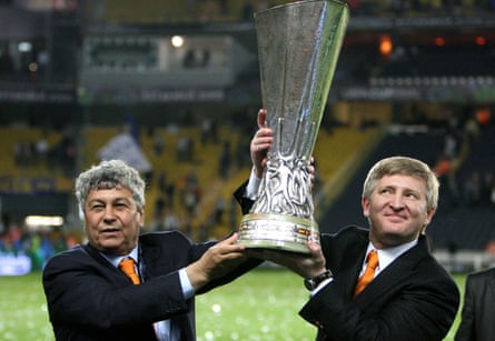 Rinat Akhmetov and coach Mircea Lucescu lift the Uefa Cup after Shakhtar beat Werder Bremen in the 2009 final.