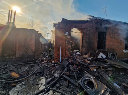 Smoke rising from destroyed one-storey building