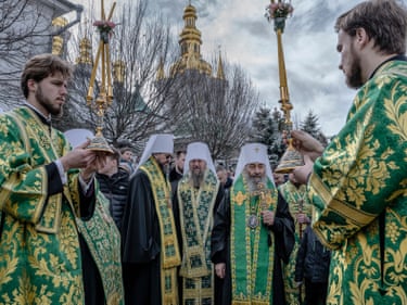Primate Onufriy Berezovsky (second right) prays with priests