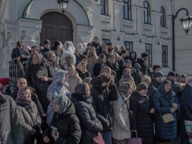People gather outside the Pechersk Lavra monastery