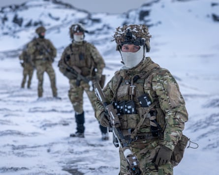 Danish soldiers in fatigues take part in a shooting practice at an undisclosed location in Greenland