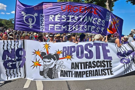 Protesters hold banners indicating feminist resistance, anti-fascism and anti-imperialism, with the message: ‘no G7’.  