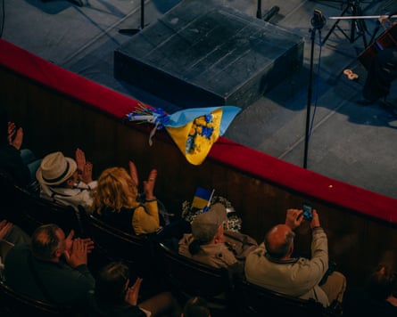 A bouquet of flowers in Ukrainian colours at the front of the stage