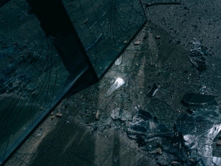 Shattered glass on the ground.