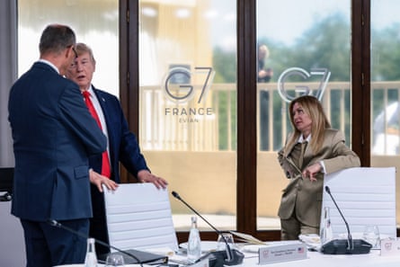 Donald Trump speaks to Germany’s Friedrich Merz and Giorgia Meloni during a work lunch as part of the G7 summit, in Evian