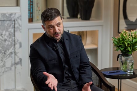 Zelenskyy gestures as he speaks