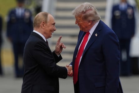 two men shake hands