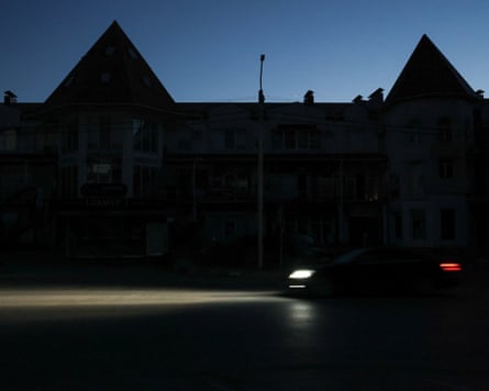 Car headlights on dark street