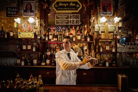 a bartender mixes a drink