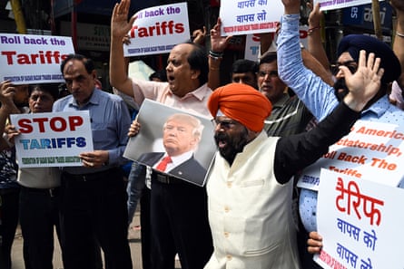 people hold signs at a protest