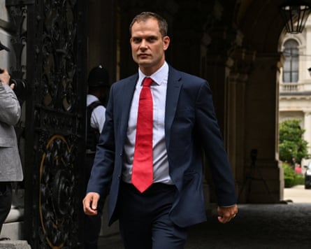 Hamish Falconer leaving a government building