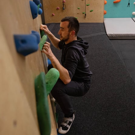 Andriy Onopriienko on a climbing wall