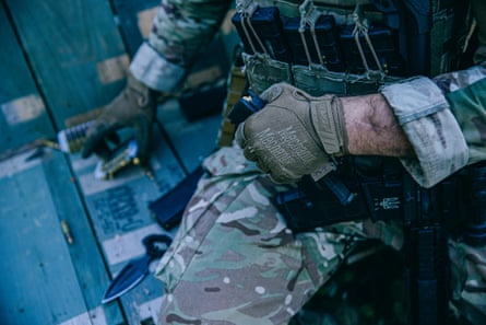 Dzhango loads a magazine during the shift.