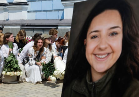 Mourners pay their respects to Vitalina Yarovenko who was killed helping survivors of a Russian attack on Kyiv.
