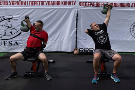 Serhii Chabanov lifts a kettlebell above his head