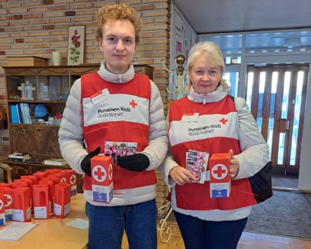 Nikita and Olga Belov wearing Red Cross tops