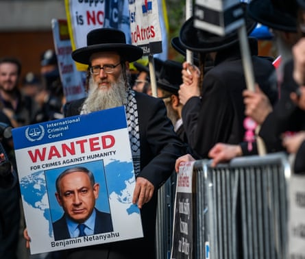 A protester holds a sign against Israeli prime minister Benjamin Netanyahu outside the UN on Wednesday.
