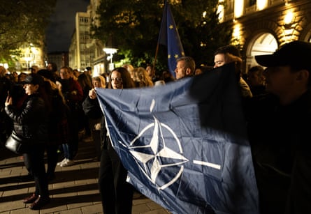 A crowd of protesters at night.