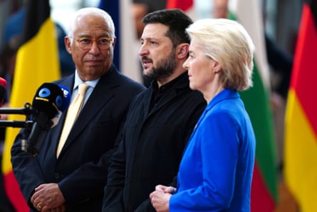 Costa, Zelenskyy and von der Leyen standing together speaking into a microphone