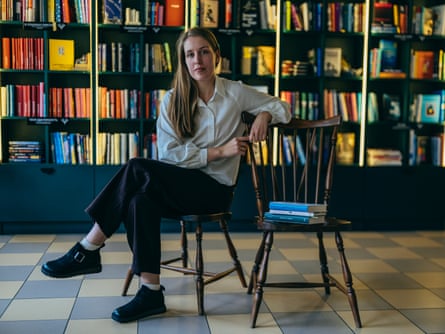 Kateryna Sova, the co-founder of Krapky publishing house, posing for a portrait in bookstore in Kremenchuk.