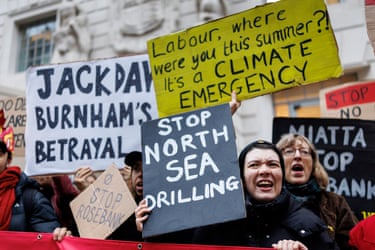 Climate protesters hold placards reading ‘Stop North Sea Drilling’ and ‘Climate Emergency’